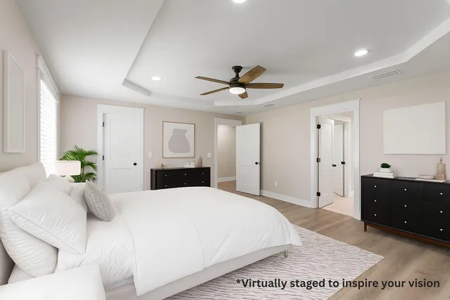 a large white bed in a white room