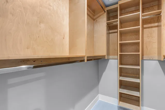 a view of an empty walk in closet