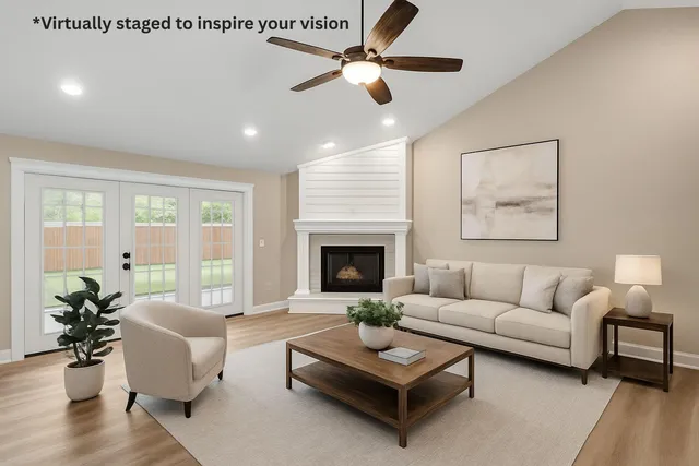 a living room with furniture and a fireplace