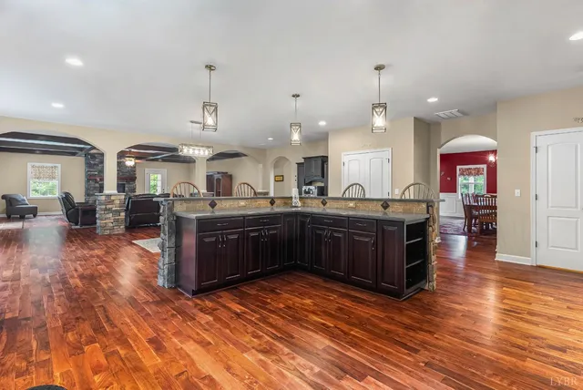 a living room with furniture a window and a fireplace