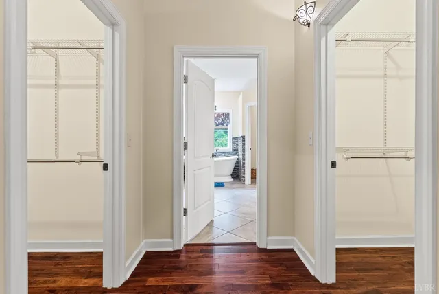 a living room with hard wood floors and a table
