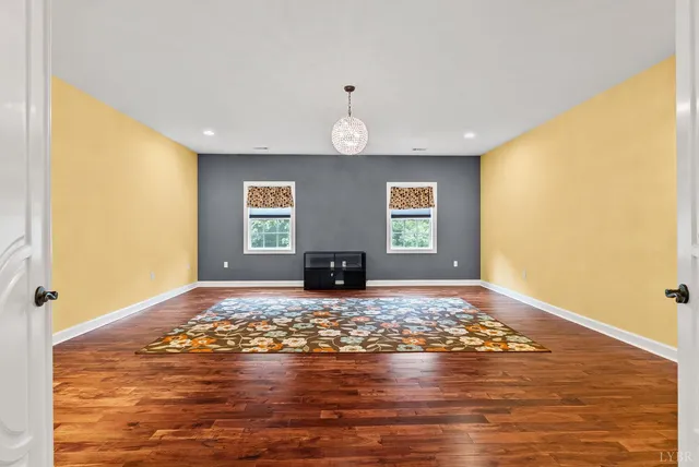 a room with a mirror and a lamp