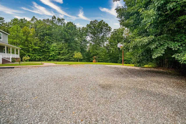 a view of a swimming pool with a yard