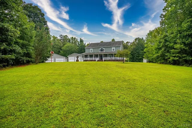 a backyard of a house with lots of green space