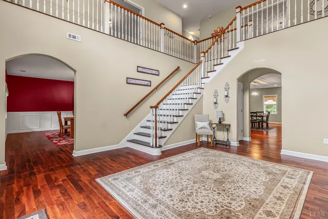 a view of a workspace with furniture and wooden floor