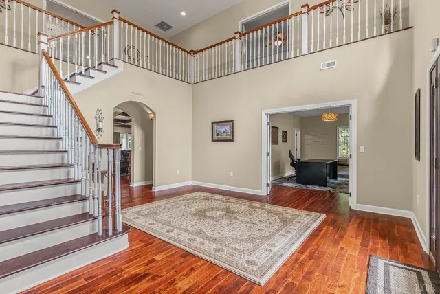 a room with wooden floor and closet