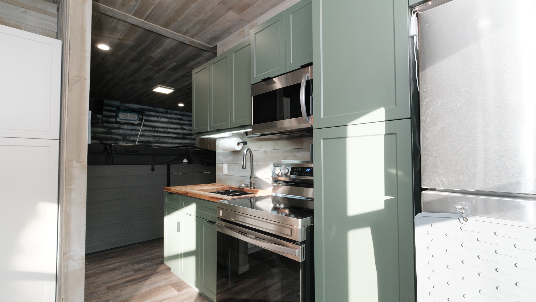 601 Pumpkin Ridge Road Dover, TN 37058 - Photo 33 of 50 a kitchen with stainless steel appliances granite countertop a stove and a microwave
