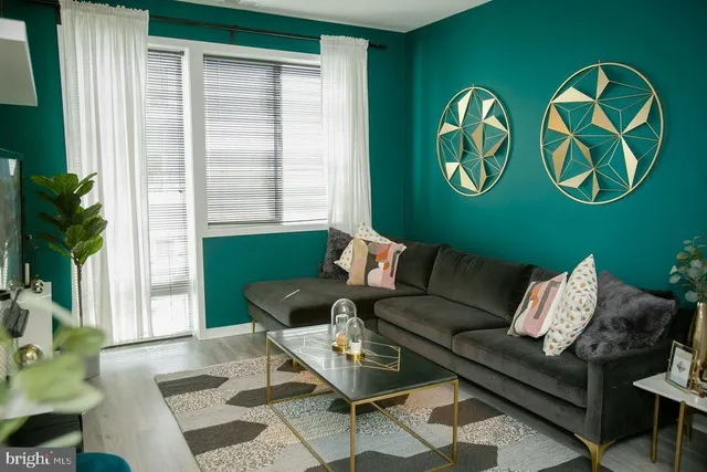 a room with pool table table soccer and windows