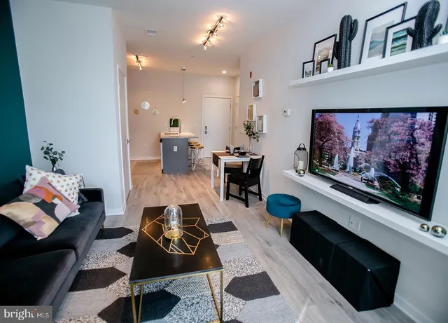 a living room with furniture and a flat screen tv
