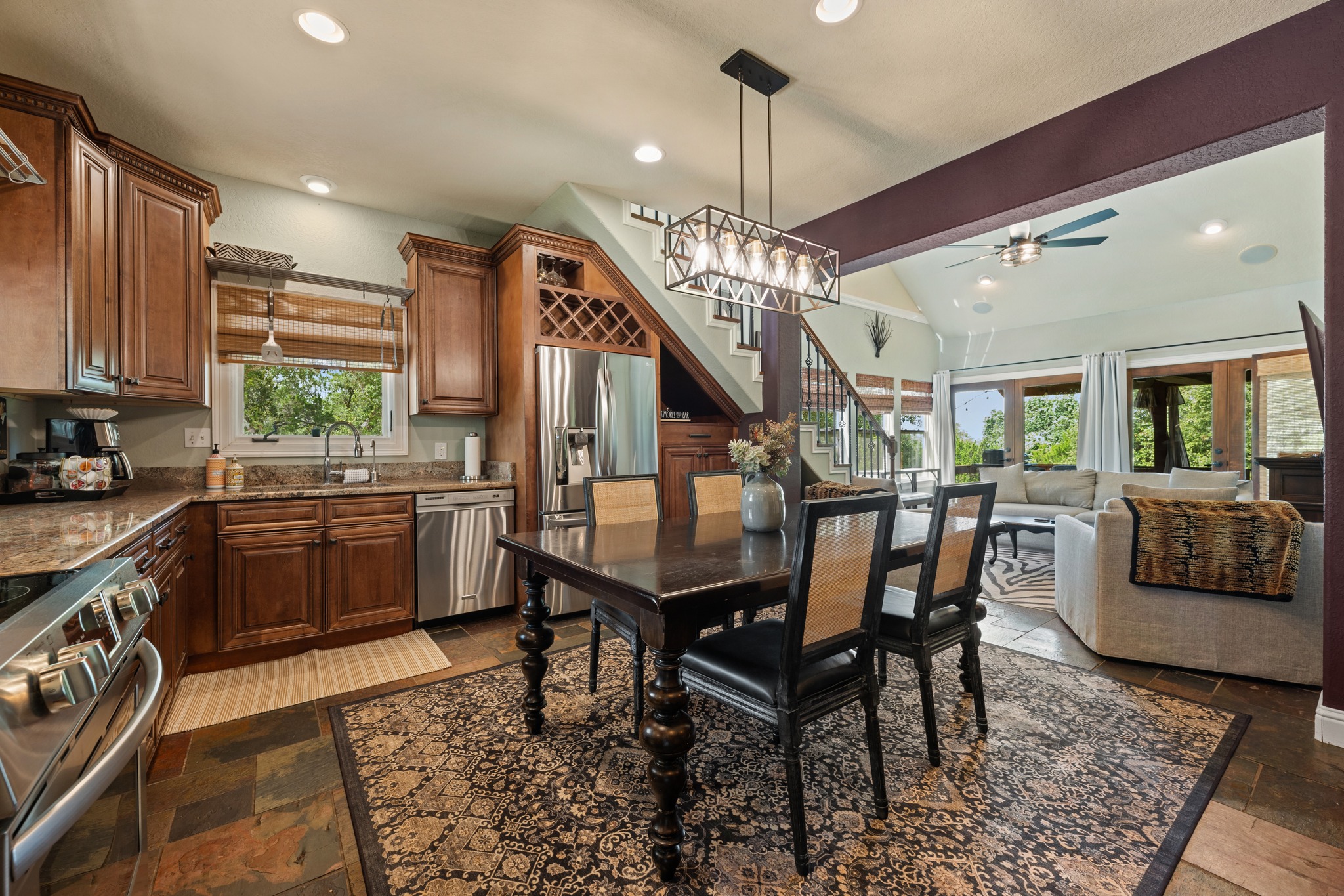 12932 Nutty Brown Road Austin, TX 78737 - Photo 8 of 40 The Manor - Bright, open kitchen with generous cabinetry and seamless flow into the dining area.
