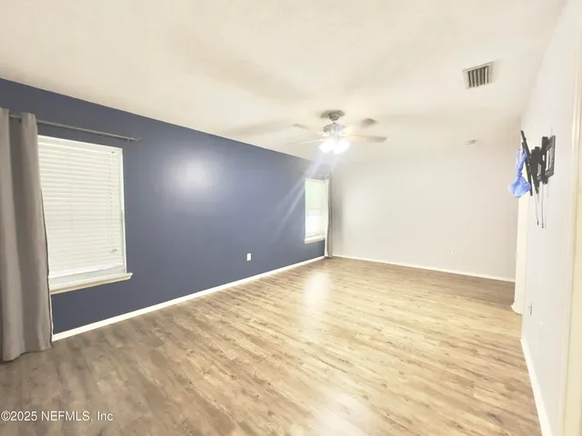 a view of an empty room with a window