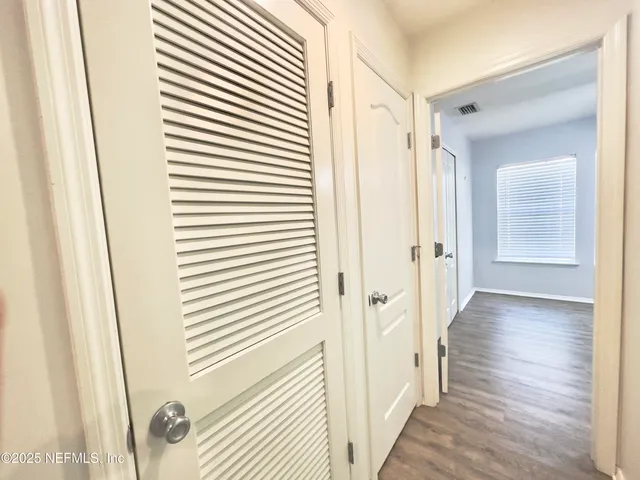 a view of a bathroom from the hallway