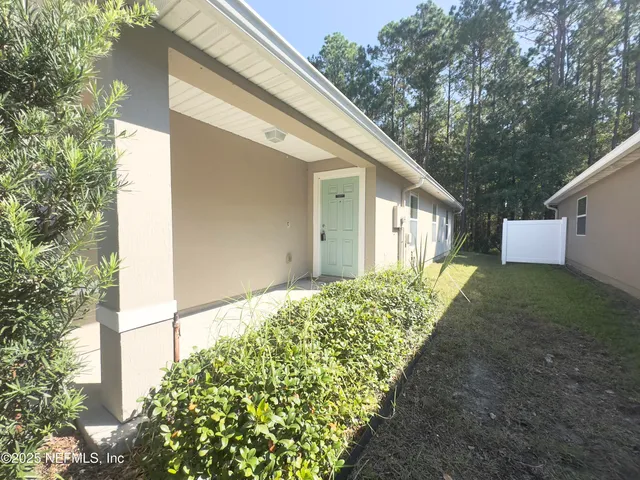 a backyard of a house with lots of green space