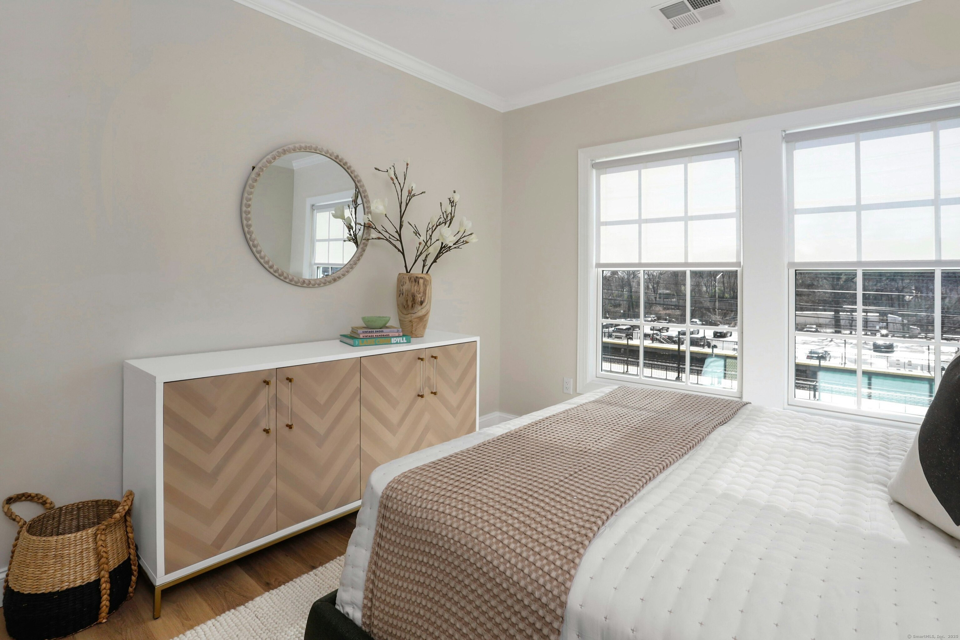 440 Heights Road, Unit 205 Darien, CT 06820 - Photo 9 of 15 a bedroom with a bed mirror and window