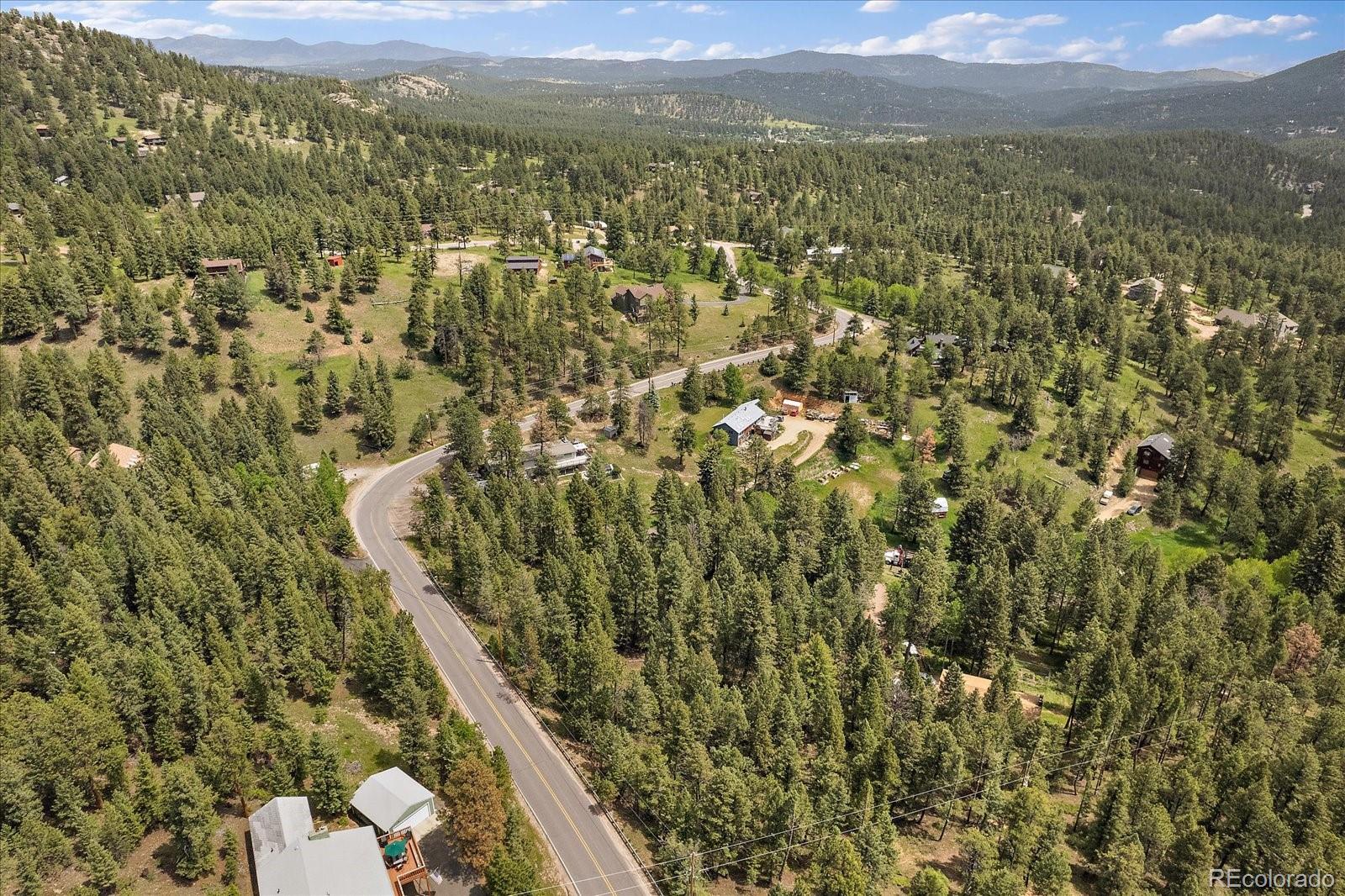 30540 Cobb Road Evergreen, CO 80439 - Photo 12 of 12 a view of a city with mountain