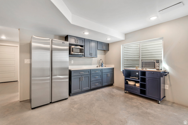 3232 West 1670th Street North Provo, UT 84601 - Photo 30 of 33 Kitchen with stainless steel appliances, recessed lighting, light countertops, and concrete floors
