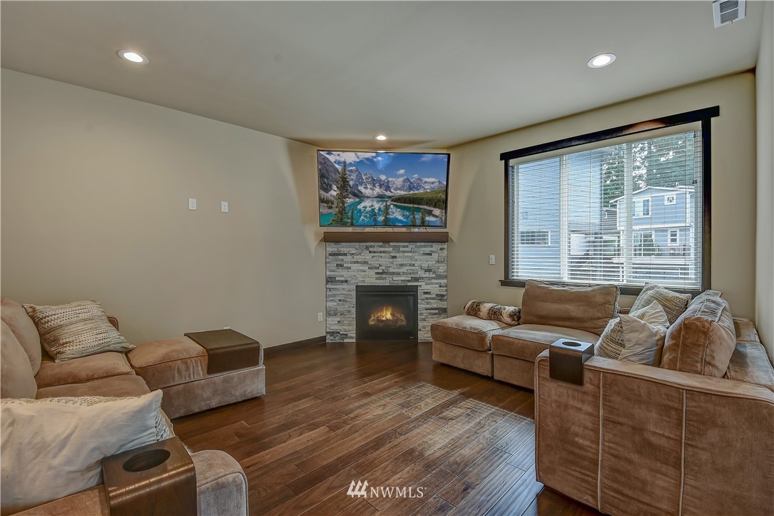 22806 23rd Avenue Southeast, Unit 1 Bothell, WA 98021 - Photo 3 of 20 a living room with furniture and a fireplace