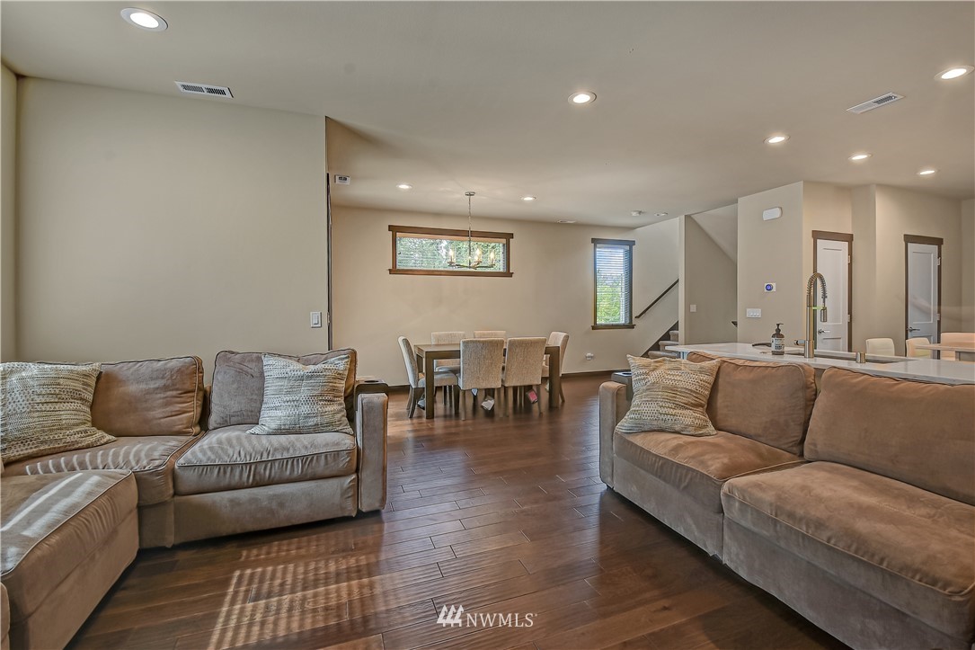 22806 23rd Avenue Southeast, Unit 1 Bothell, WA 98021 - Photo 4 of 20 a living room with furniture and a couch