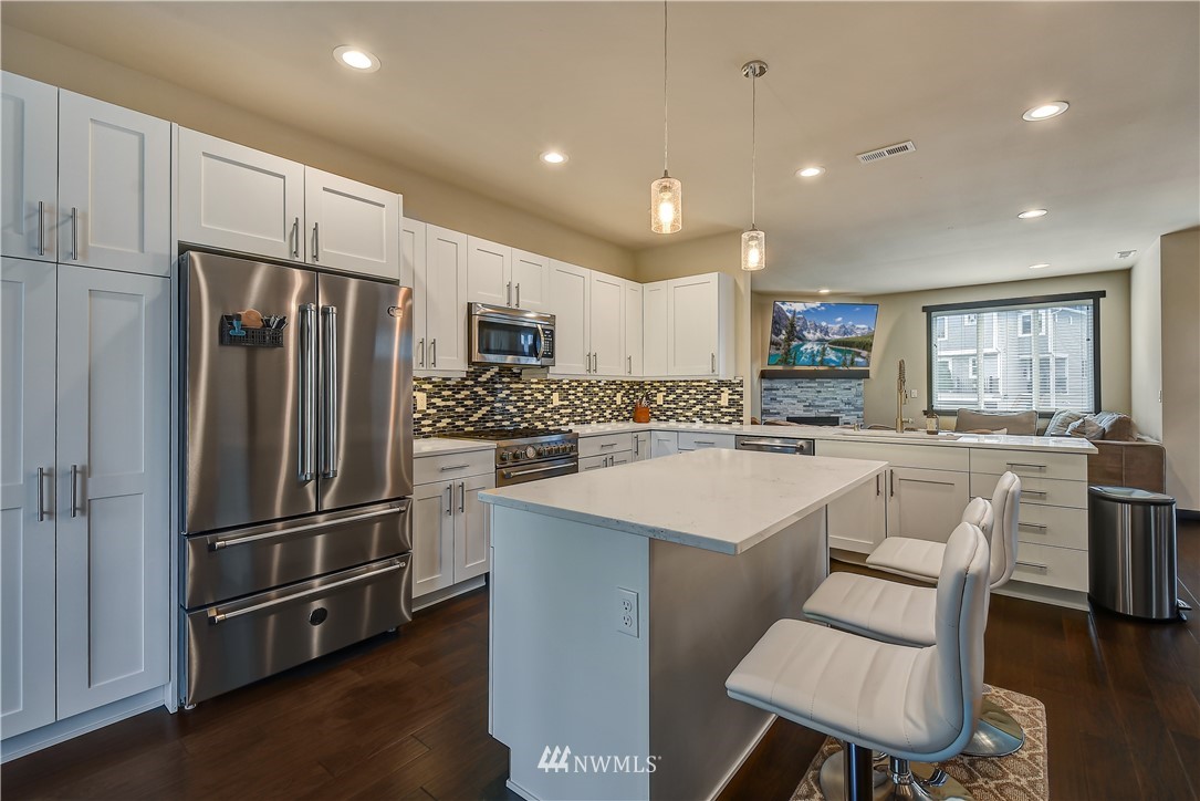 22806 23rd Avenue Southeast, Unit 1 Bothell, WA 98021 - Photo 6 of 20 a kitchen with counter top space cabinets and stainless steel appliances
