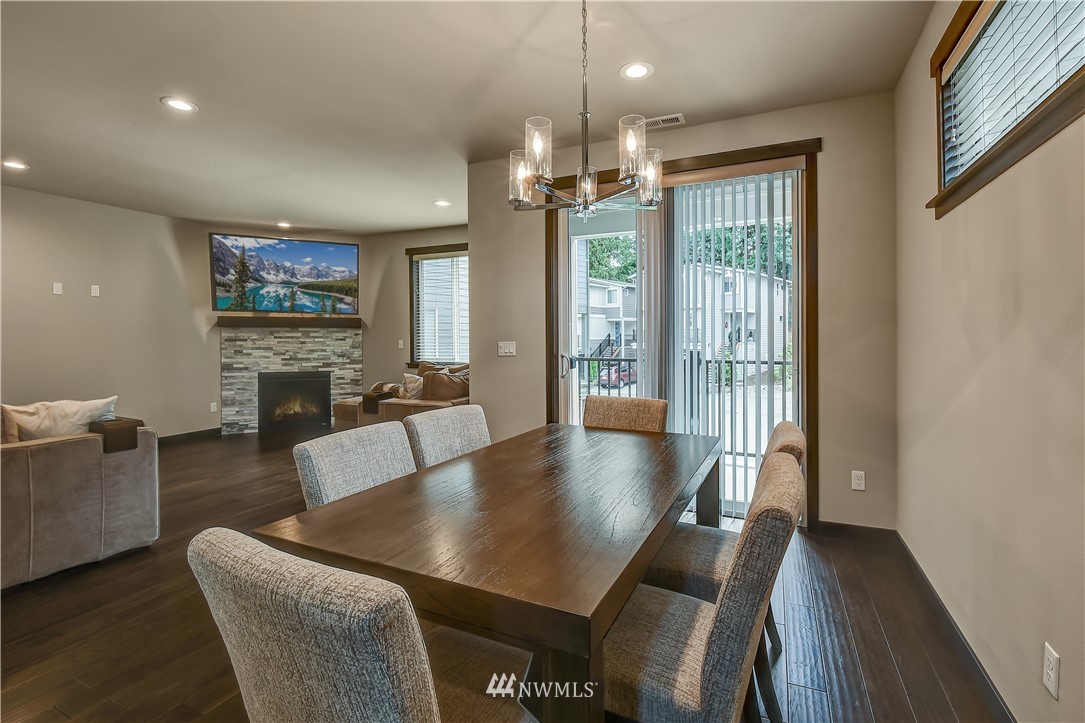22806 23rd Avenue Southeast, Unit 1 Bothell, WA 98021 - Photo 8 of 20 a view of a dining room with furniture window and wooden floor