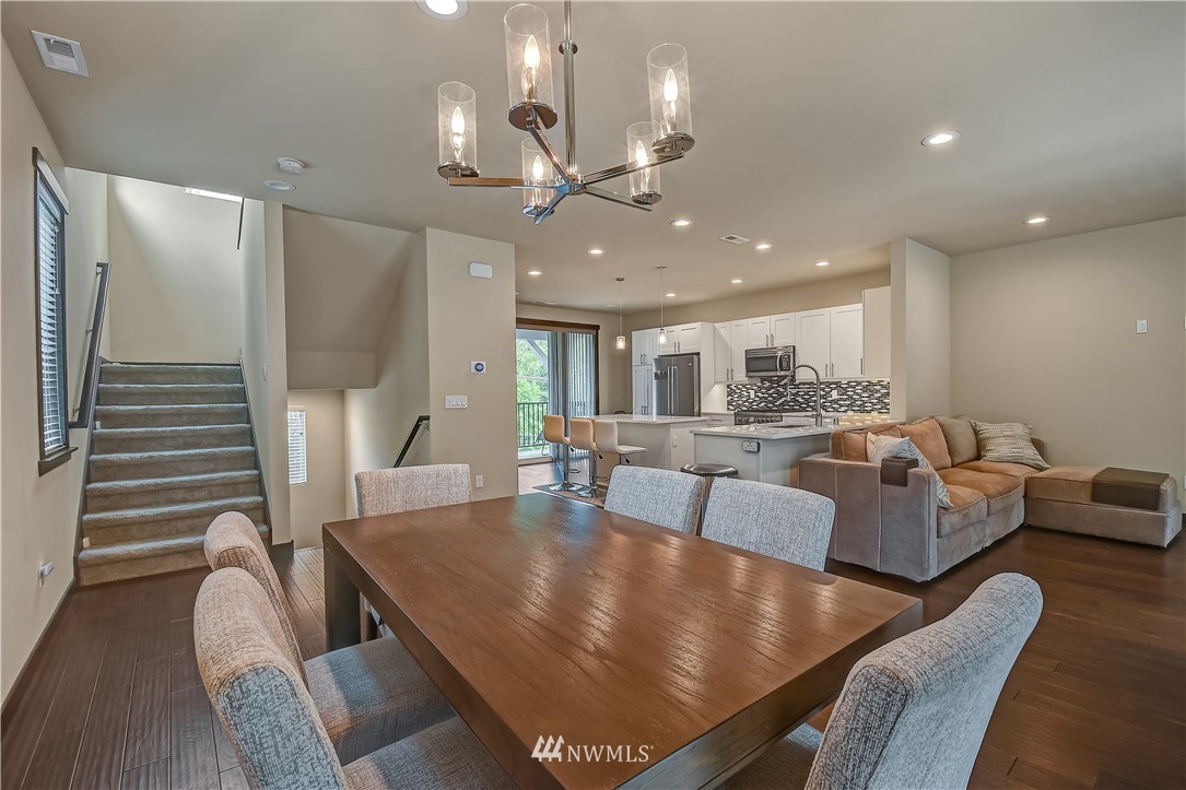 22806 23rd Avenue Southeast, Unit 1 Bothell, WA 98021 - Photo 10 of 20 a dining room with furniture and wooden floor