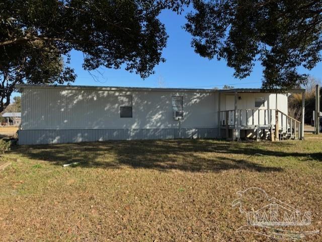 6114 East Fence Road Pensacola, FL 32526 - Photo 2 of 8 a view of swimming pool with a yard
