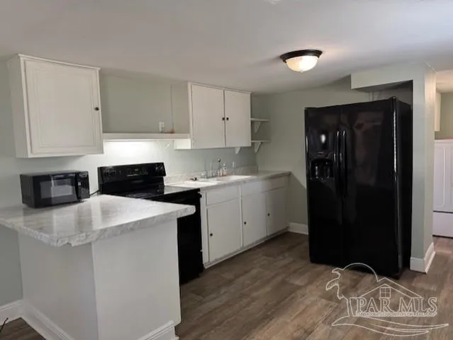 a kitchen with a sink and cabinets