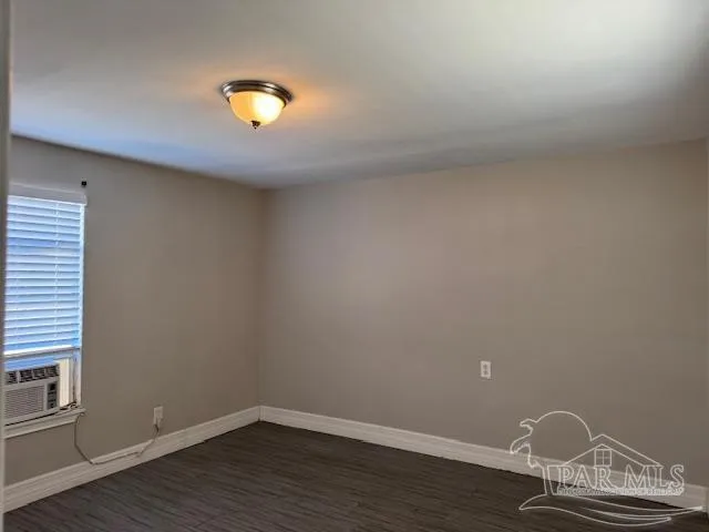 a view of room with hardwood floor and ceiling fan