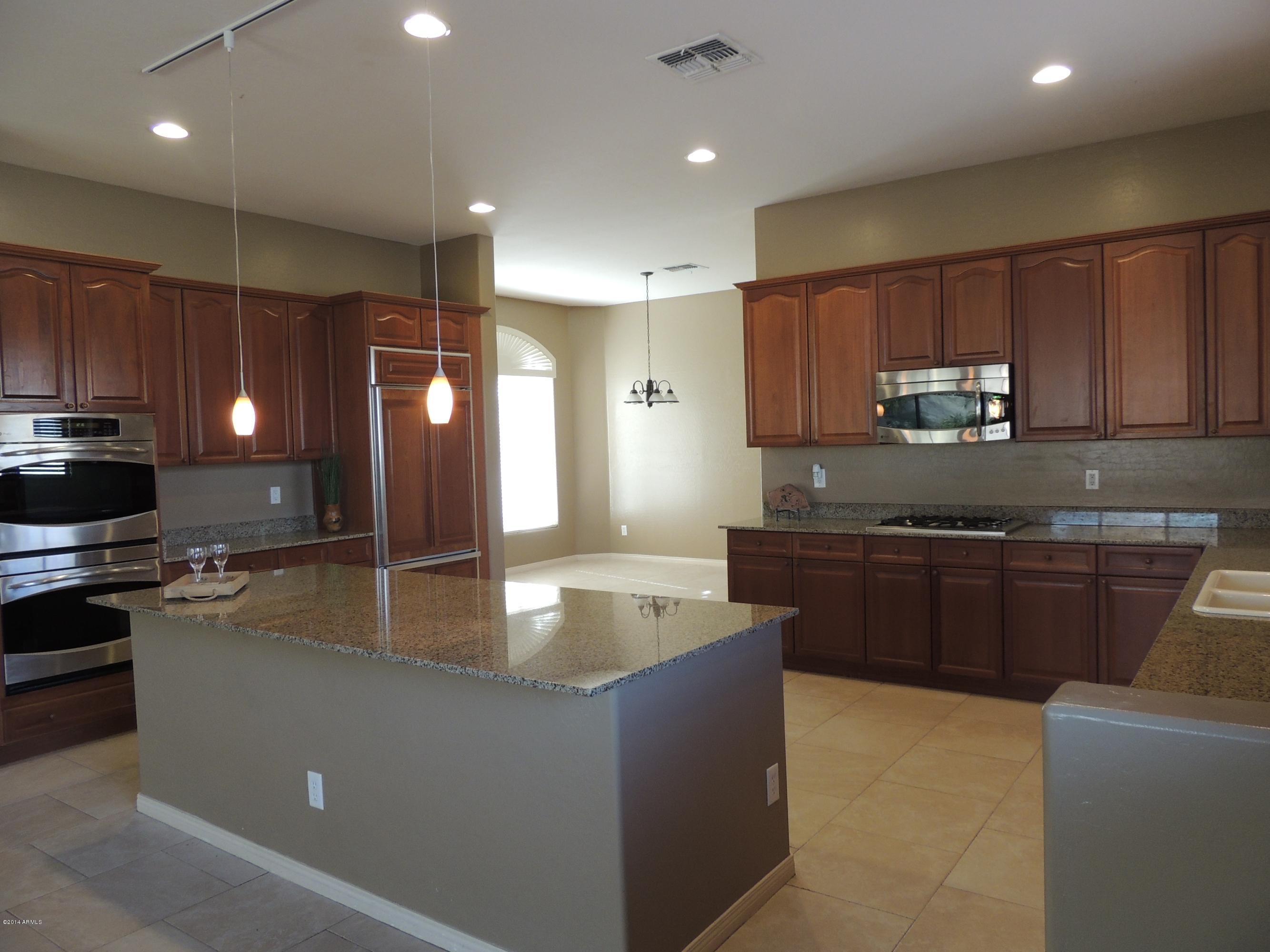 4637 South Bandit Road Gilbert, AZ 85297 - Photo 15 of 49 Double ovens and built in fridge
