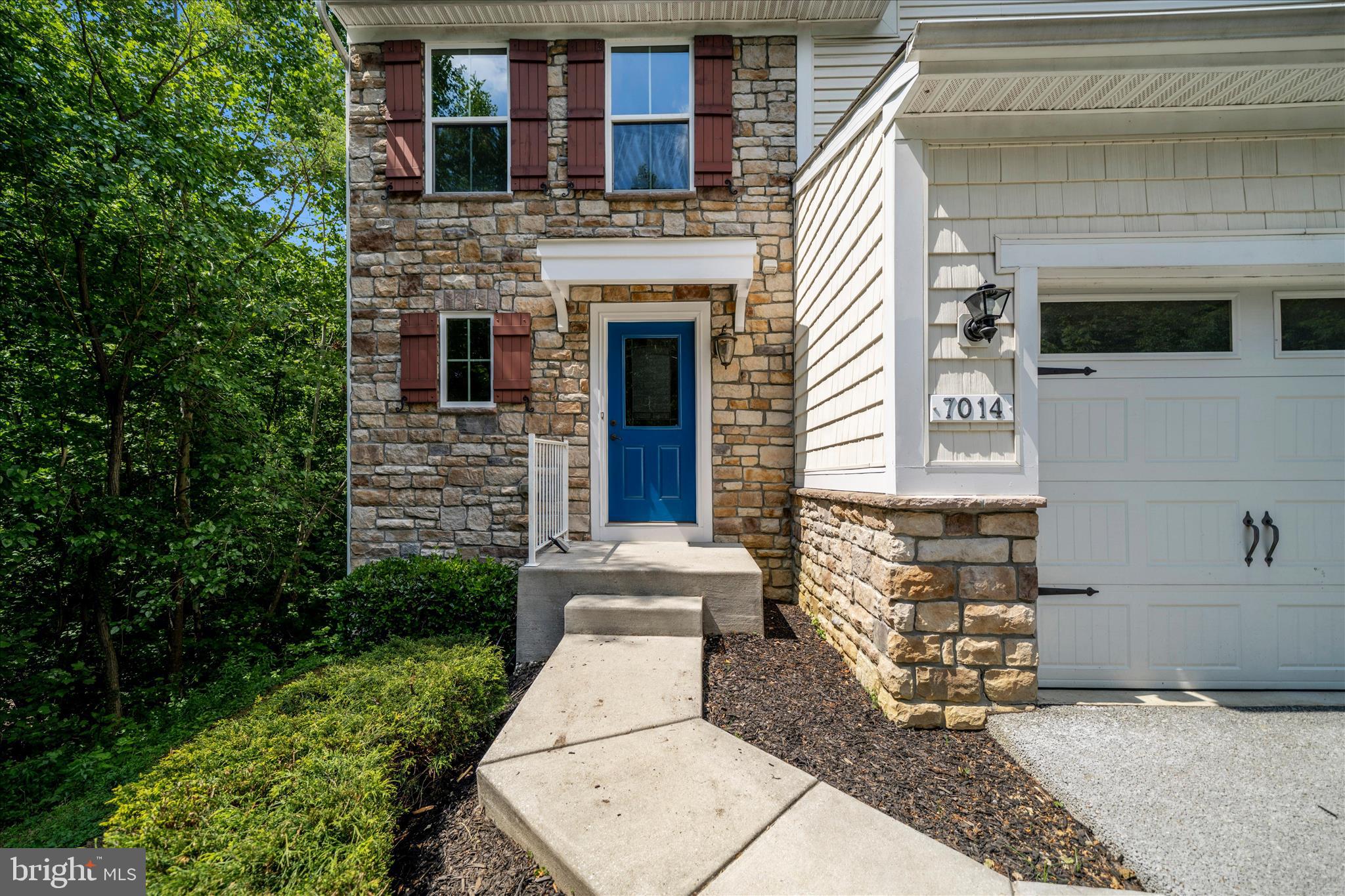 7014 Linden Avenue Elkridge, MD 21075 - Photo 2 of 42 a front view of a house with garden
