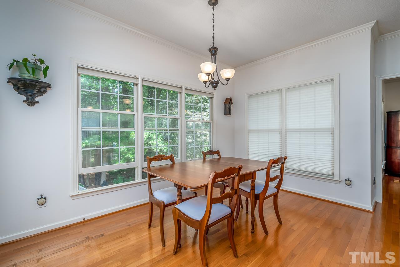 2308 Bolingbrook Lane Raleigh, NC 27613 - Photo 11 of 30 a view of a dining room with furniture window and wooden floor