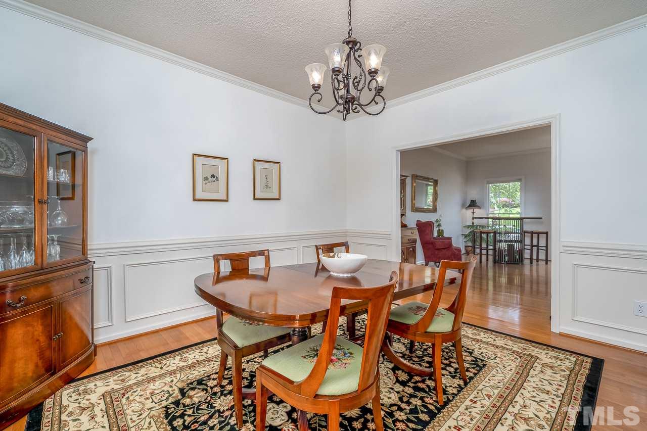 2308 Bolingbrook Lane Raleigh, NC 27613 - Photo 13 of 30 a view of a dining room with furniture and wooden floor