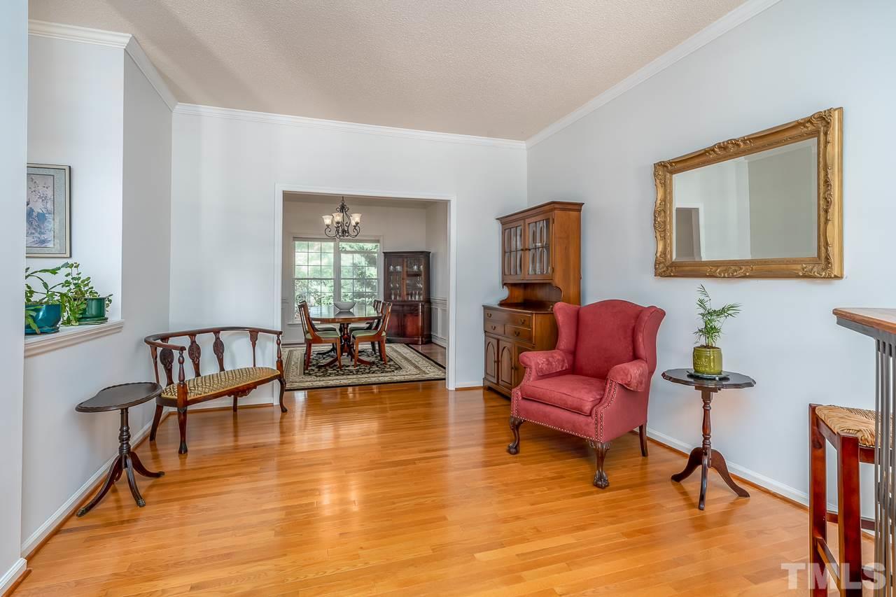 2308 Bolingbrook Lane Raleigh, NC 27613 - Photo 14 of 30 a living room with furniture and a wooden floor