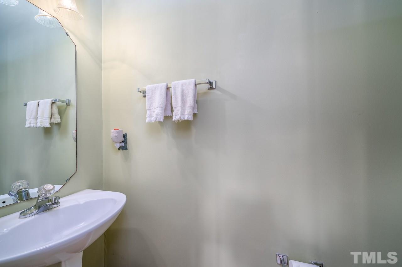2308 Bolingbrook Lane Raleigh, NC 27613 - Photo 16 of 30 a bathroom with a sink and a mirror