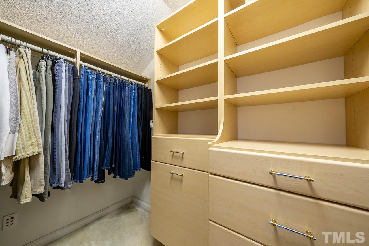 2308 Bolingbrook Lane Raleigh, NC 27613 - Photo 22 of 30 a view of walk in closet with clothes