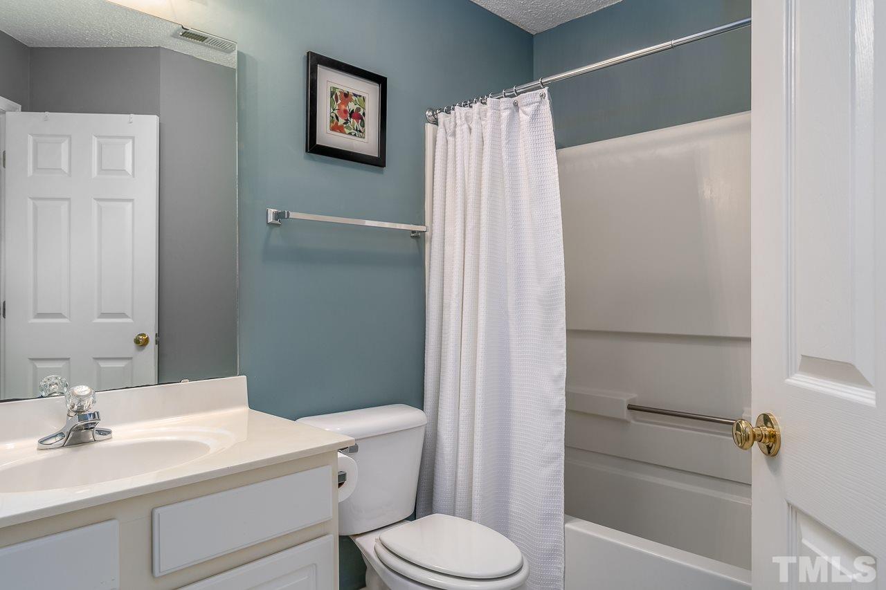 2308 Bolingbrook Lane Raleigh, NC 27613 - Photo 26 of 30 a bathroom with a sink toilet and shower