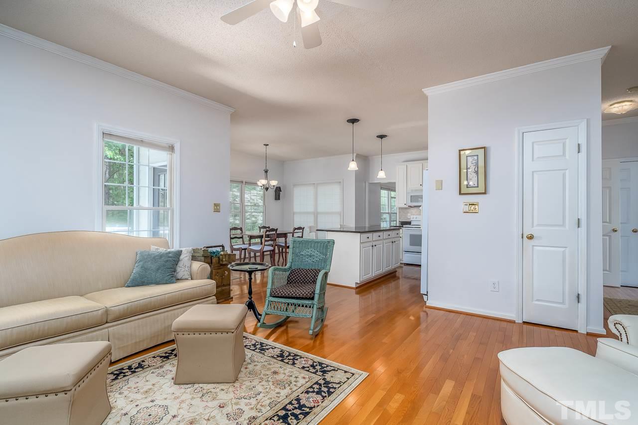2308 Bolingbrook Lane Raleigh, NC 27613 - Photo 7 of 30 a living room with furniture and wooden floor