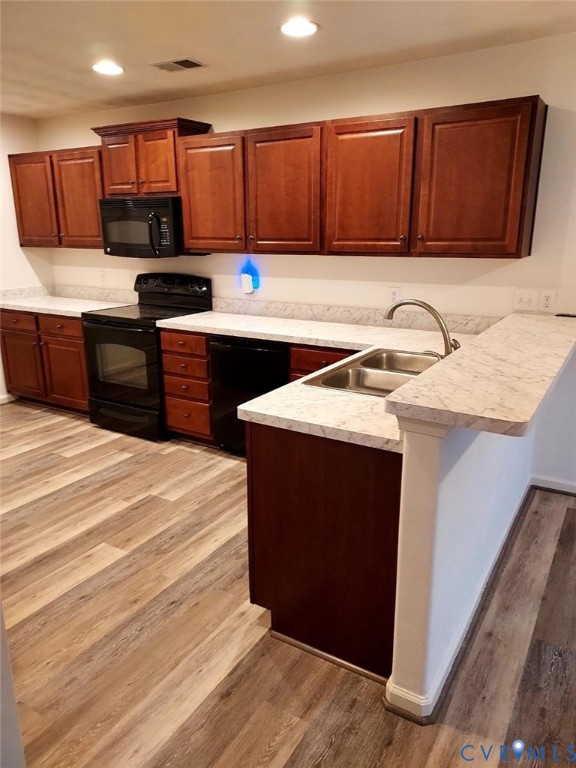 2415 Prince Andrew Court Quinton, VA 23141 - Photo 5 of 12 a kitchen with stainless steel appliances granite countertop a sink stove and refrigerator