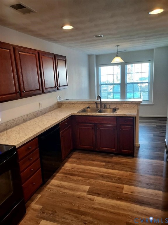 2415 Prince Andrew Court Quinton, VA 23141 - Photo 8 of 12 a kitchen with stainless steel appliances granite countertop a sink and wooden cabinets