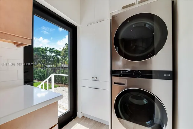 a view of a hallway with washer and dryer