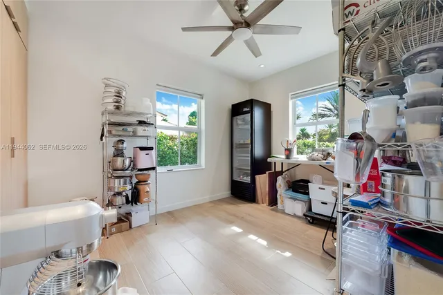 a view of a livingroom with furniture and a window