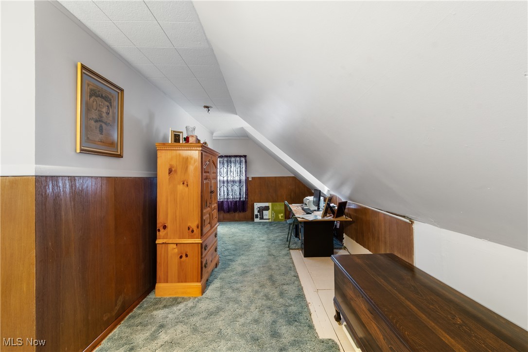 720 Ina Avenue Akron, OH 44306 - Photo 19 of 30 Additional living space featuring carpet flooring, lofted ceiling, and wood walls