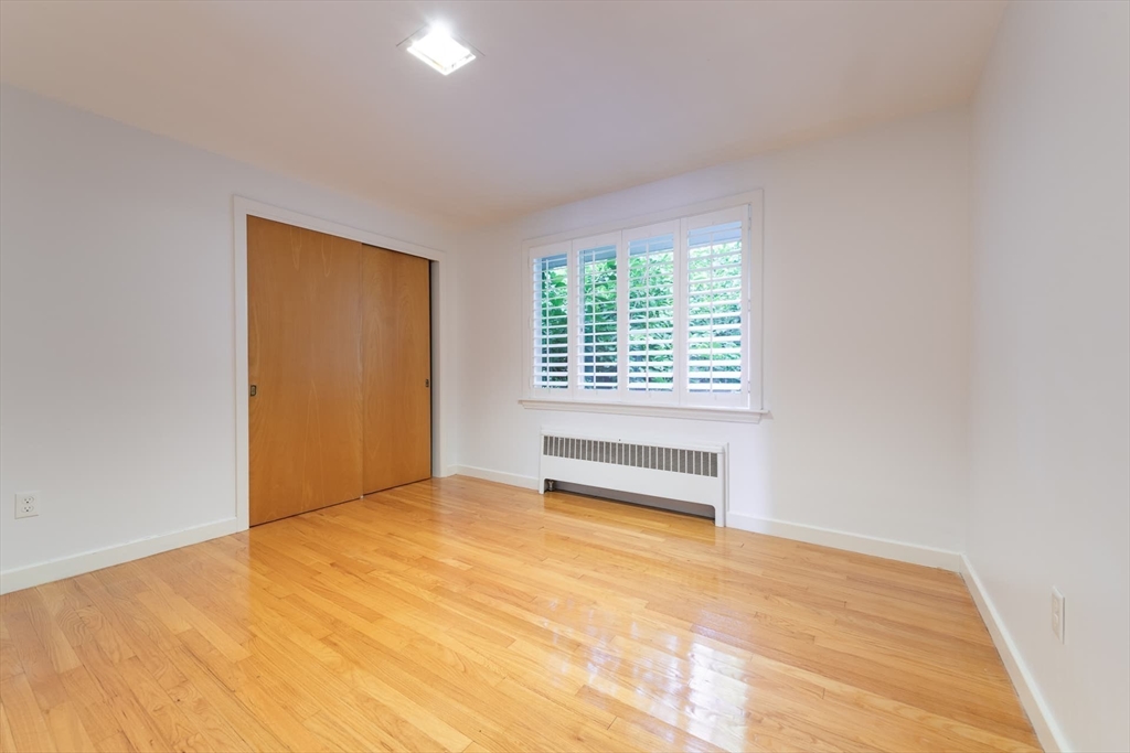 110 Robin Road Weston, MA 02493 - Photo 24 of 40 a view of an empty room with a window