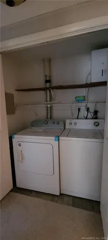 a utility room with washer and dryer
