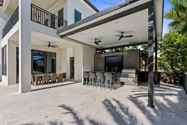a view of a room with lots of furniture and flat screen tv