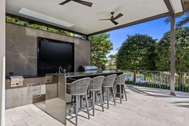 a view of a chairs and table in patio