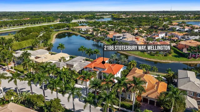 an aerial view of residential houses with outdoor space and river
