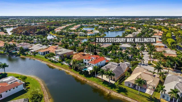 an aerial view of residential houses with outdoor space and river