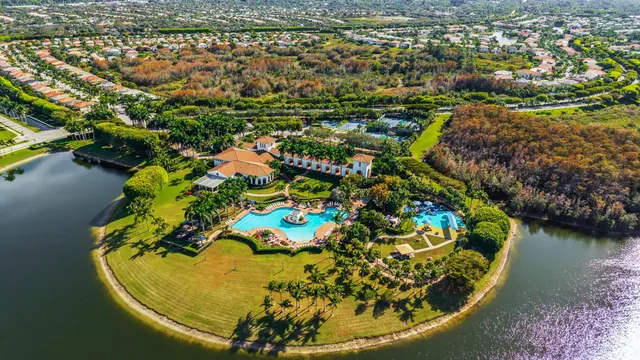 a view of a swimming pool with a yard