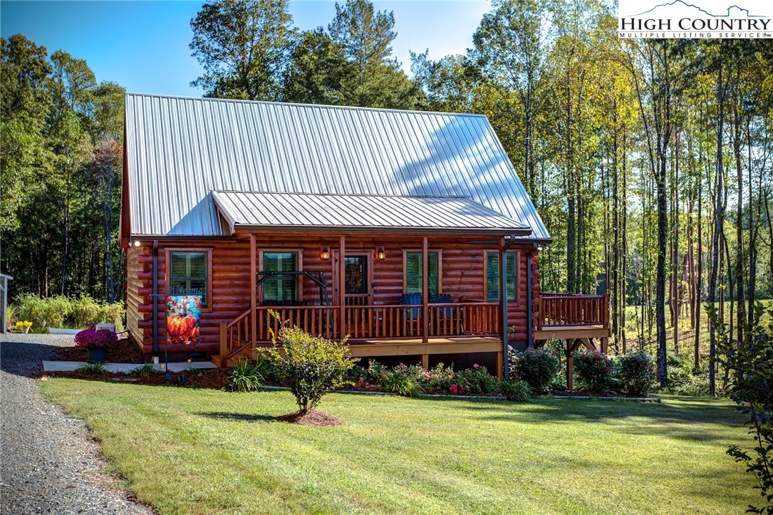 3460 South Center Church Road Thurmond, NC 28683 - Photo 2 of 50 a front view of a house with garden